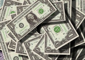 US dollars piled up randomly - from top