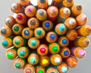 A picture of a bunch of colored pencils in a group from a top view looking down.