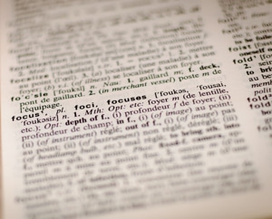 Picture of a page in a dictionary focused on the word "focus."