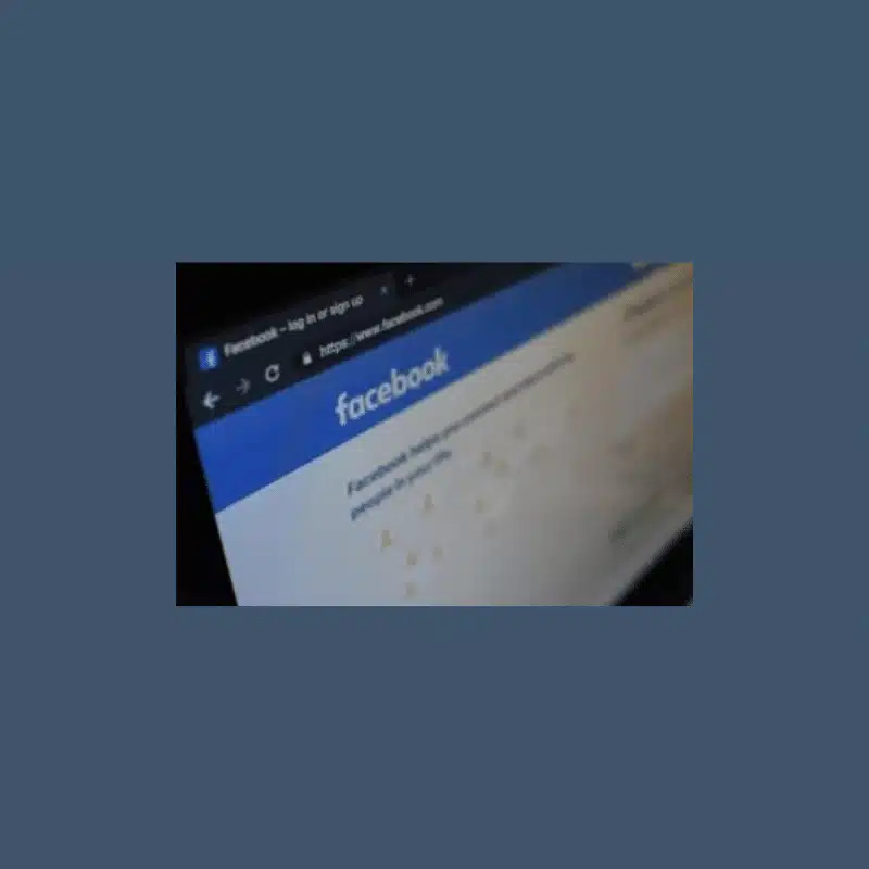 Photo of a laptop screen with Facebook in the web browser.