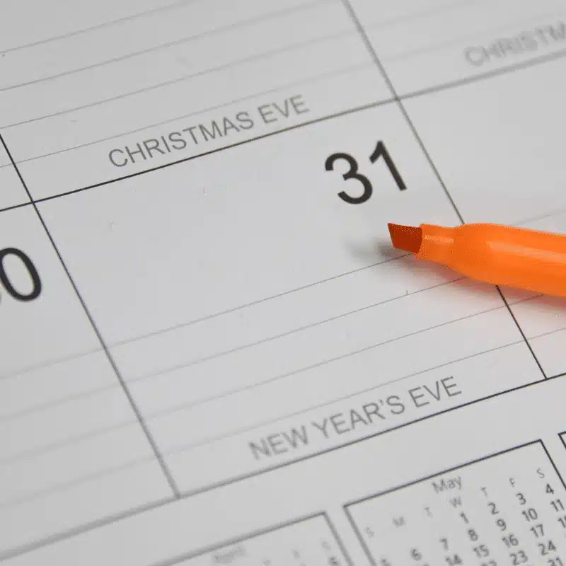 Picture of a calendar and a highlighter focused on December 31st, New Year's Eve.