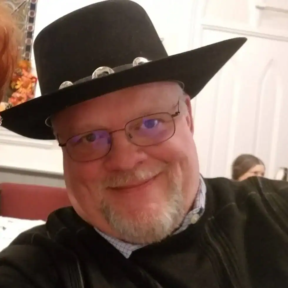 Rev. Christy Ramsey in a black cowboy hat.